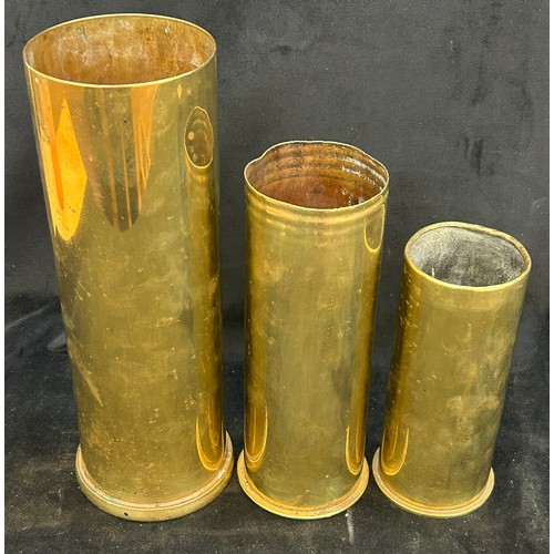 Three military brass shells, tallest measures approximately: 12 inches