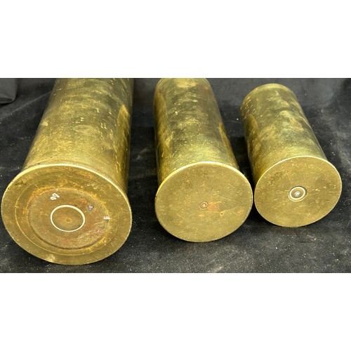 Three military brass shells, tallest measures approximately: 12 inches