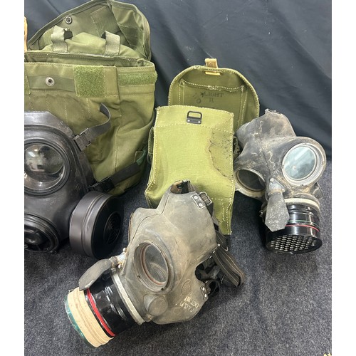 Selection of WW2 gas masks, some in original packaging and bags