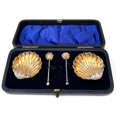 4 - Antique silver shell salt set featuring two scallop shell dishes and two matching spoons, presented ... 