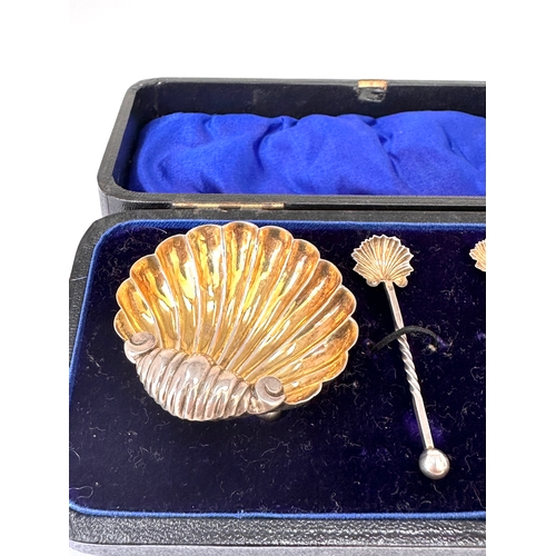 4 - Antique silver shell salt set featuring two scallop shell dishes and two matching spoons, presented ... 