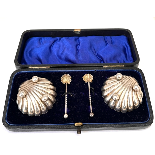 4 - Antique silver shell salt set featuring two scallop shell dishes and two matching spoons, presented ... 