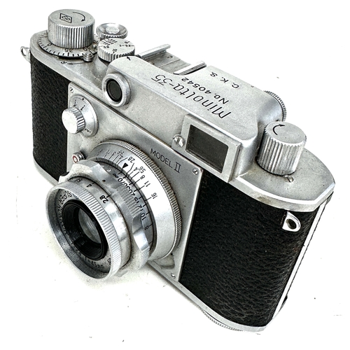 Minolta-35 Model II 35mm rangefinder camera equipped with a