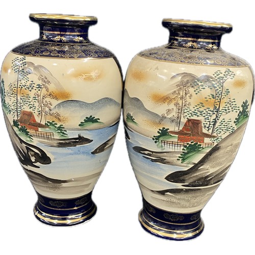 37 - A pair of Japanese satsuma style ceramic vases measuring 12