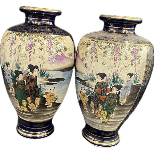 37 - A pair of Japanese satsuma style ceramic vases measuring 12