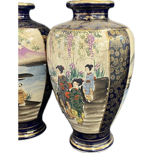 37 - A pair of Japanese satsuma style ceramic vases measuring 12
