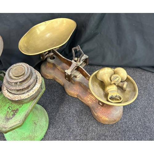 28 - Two vintage cast iron balance scales with assorted weights