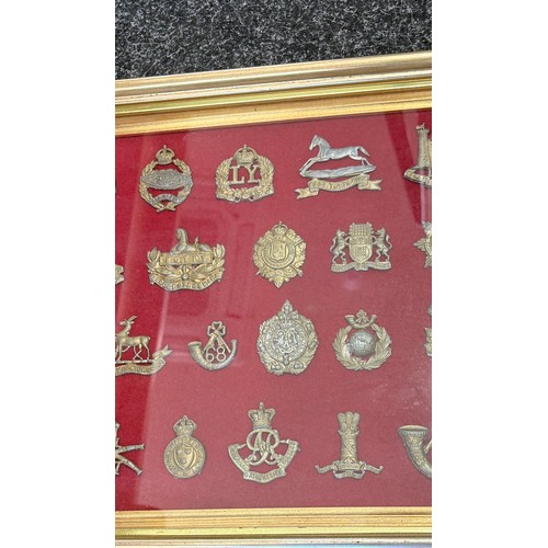 29 - Framed selection of vintage cap badges - 24 in total, frame measures 13 x 15.5 inches