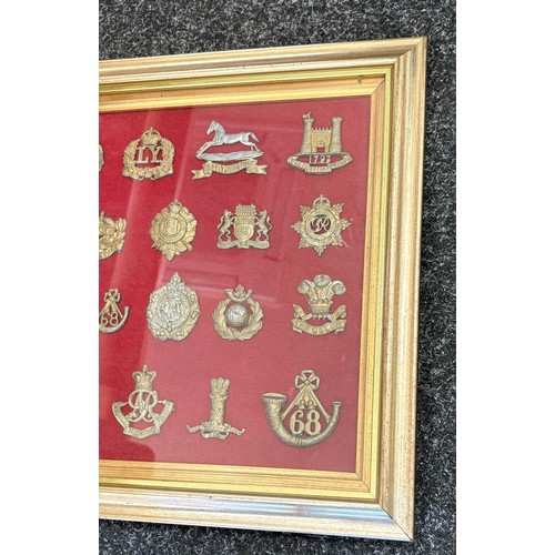 29 - Framed selection of vintage cap badges - 24 in total, frame measures 13 x 15.5 inches