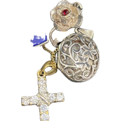 4 Silver pendants and chains to include a cross, a locket etc