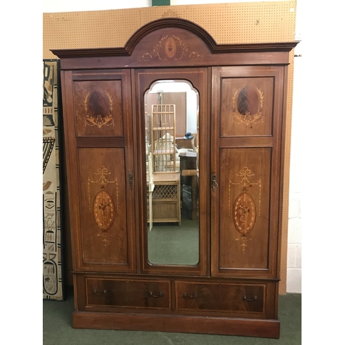 677 - Edwardian wardrobe with hanging rail over 2 drawers. The front with mirrored central door surrounded... 