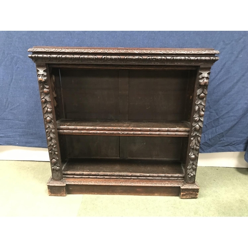 676 - Heavily carved Black Forest style C19th four shelf book case