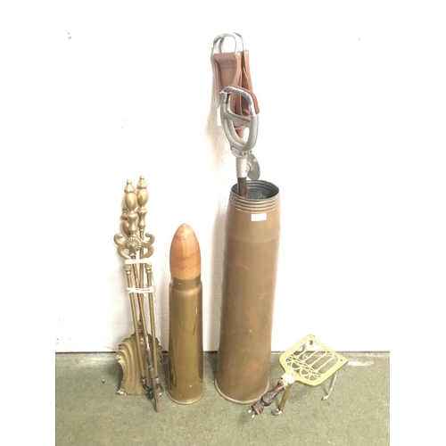 245 - Large (64 x 16cm) brass shell case, 2 shooting sticks, fire irons & a trivet. 1917 shell case (42cm)