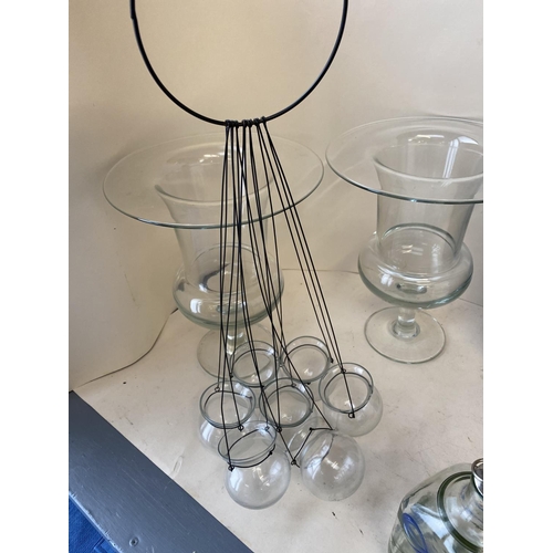 24 - Pair of large glass vases, qty of glass candle holders, glass plates, large qty of tea light holders... 