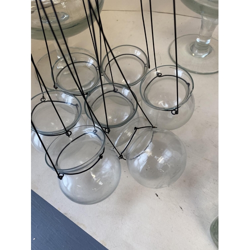 24 - Pair of large glass vases, qty of glass candle holders, glass plates, large qty of tea light holders... 