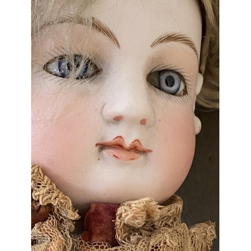 34 - Vintage doll -  porcelain head, leather legs, and period dress (condition - some general wear - see ... 