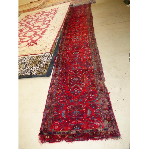 725 - Old traditional red ground Turkey runner with all over stylised pattern.  500 x 94.  Condition  seve... 