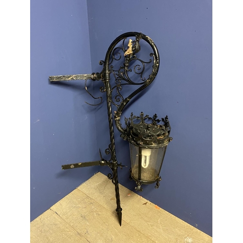 78 - External Victorian iron lamp with ornate wall bracket, converted to electricity, approx 115cmH