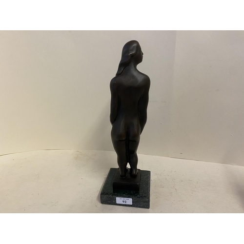 92 - Abstract Bronze figure of a nude lady on stand, 35cmH