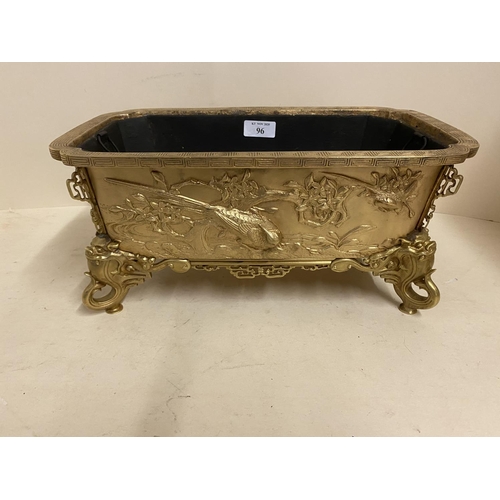 96 - Good gilded bronze oblong jardiniere, with relief decoration of exotic birds, the 4 feet of mythical... 