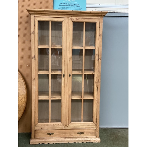 731 - Large glazed bookcase cabinet.  118cm W, 47cm D, 203cm H