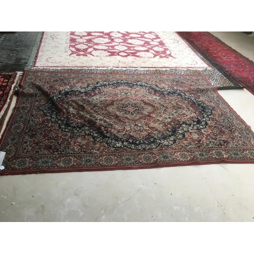 726 - Old traditional blue ground woollen rug with all over red and fawn stylised pattern   285 x 197