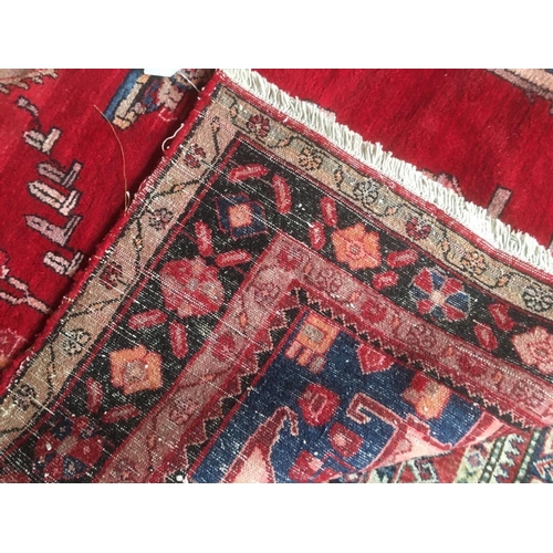 727 - Modern bright red ground woollen rug with central medallion and multi border 260 x 150