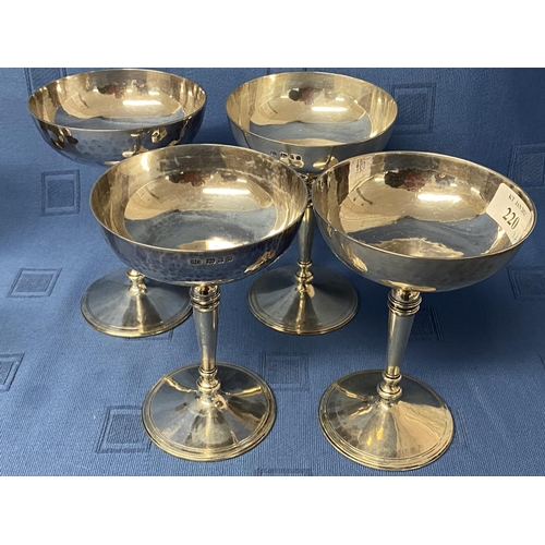 220 - Set of 4 hallmarked silver champagne saucers, London 1929.  maker SG.  The base engraved copy of a c... 