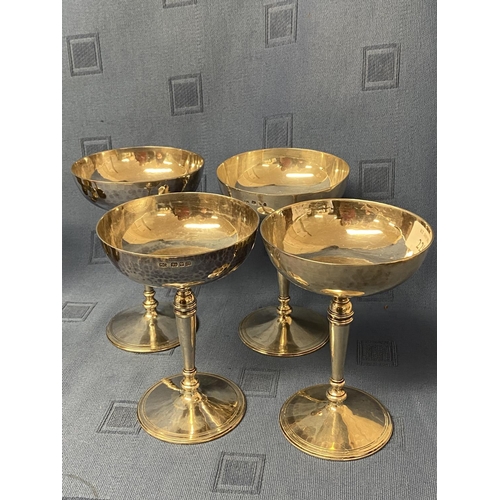 220 - Set of 4 hallmarked silver champagne saucers, London 1929.  maker SG.  The base engraved copy of a c... 