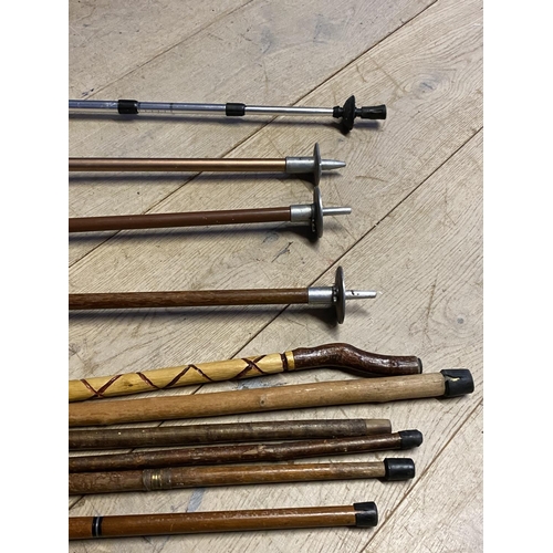 261 - Quantity of walking sticks/canes/shooting sticks, including modern HT metal anti shock adjustable wa... 