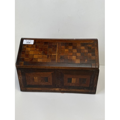 324 - C19th Country made lidded box of mixed geometric veneers, 26 cm Long