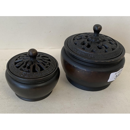 341 - 2 Chinese bronze pots with pierced lids, marks to base, 10cm D & 7.5cm (condition some wear)