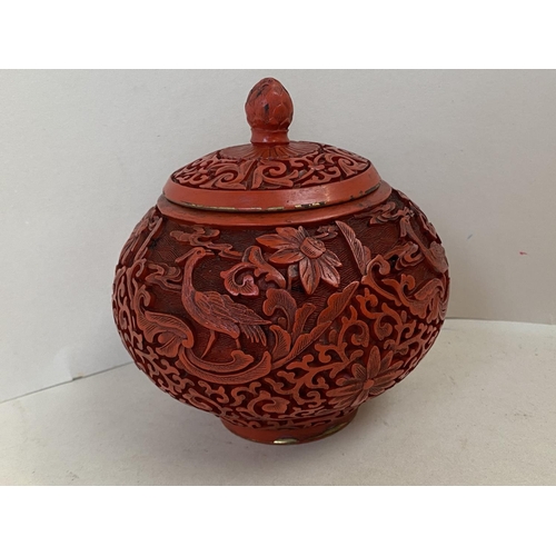 343 - Chinese carved cinnabar lacquered pot and lid, 12cm D, (condition - some wear around lid edge )