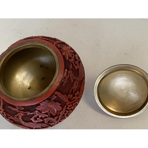 343 - Chinese carved cinnabar lacquered pot and lid, 12cm D, (condition - some wear around lid edge )