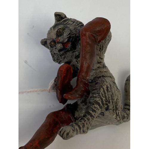 360 - Cold painted figure of a seated cat, brushing boots 7cmH (condition good)