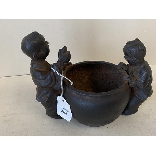 364 - Chinese iron pot flanked by two children, 12cmD, max height 16cm (condition good, some general wear ... 