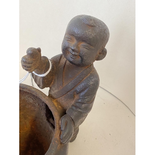 364 - Chinese iron pot flanked by two children, 12cmD, max height 16cm (condition good, some general wear ... 