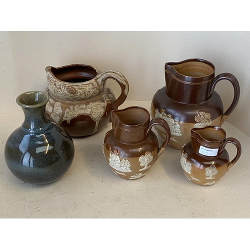 367 - Set of 3 graduated Royal Doulton harvest jugs the largest 20 cm H, and  a studio pottery vase and  g... 