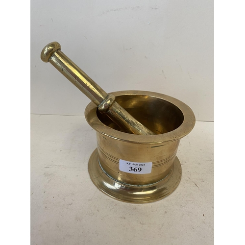 369 - Heavy polished brass pestle and mortar 13cm D  Good condition, old minor wear