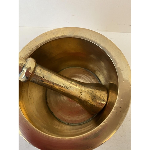 369 - Heavy polished brass pestle and mortar 13cm D  Good condition, old minor wear