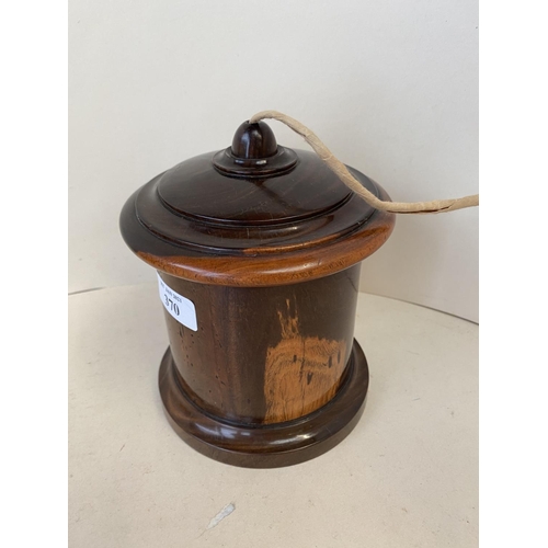 370 - Polished lignum Vitae cylindrical string box 13cm D, (condition, chip to rim of lid and a crack to l... 