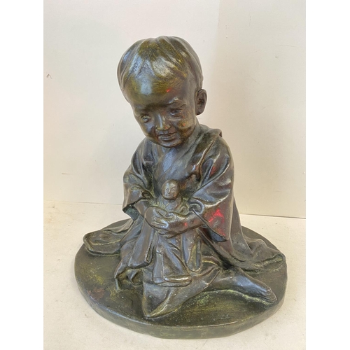 372 - Chinese hollow bronze kneeling child holding a baby, 30cm H (condition good)