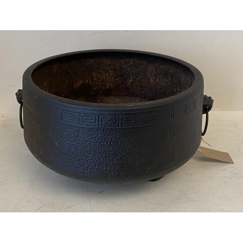 375 - Old Chinese iron cauldron with 2 ring handle and Greek key pattern