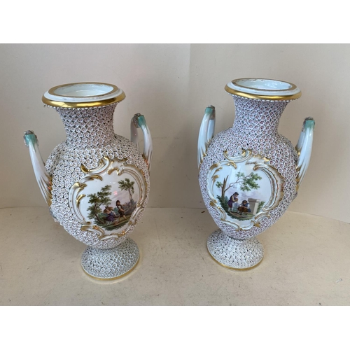 409 - Pair of Fine quality porcelain Meissen urns, each with 2 handles and central panels, decorated with ... 