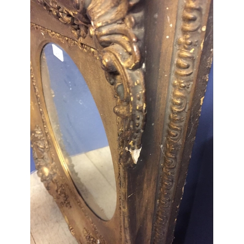 412 - Two wall mirrors: oval mirror set in ornate gilt rectangular frame 58H x 52 W overall, and a rectang... 