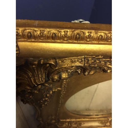 412 - Two wall mirrors: oval mirror set in ornate gilt rectangular frame 58H x 52 W overall, and a rectang... 