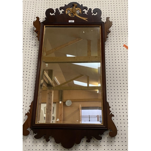 418 - Rectangular bevelled glass wall mirror, set within a mahogany rectangular frame, surmounted with a g... 