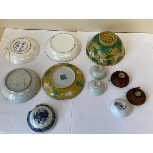 426 - Group of Chinese and Japanese saucers, cups and a bowl.
ALL OF THESE LOTS HAVE cracks/chips etc - se... 