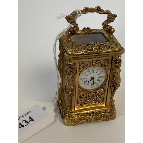 434 - Miniature ornately decorated brass carriage clock with enamel dial.  Good condition not tested worki... 