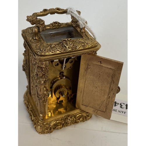 434 - Miniature ornately decorated brass carriage clock with enamel dial.  Good condition not tested worki... 